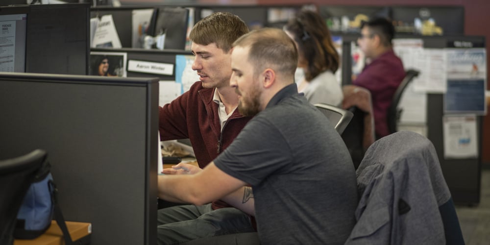 Two salespeople working together